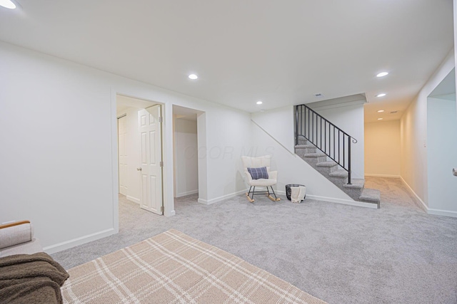 unfurnished room featuring light colored carpet