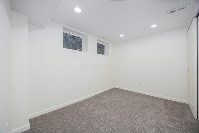 basement featuring carpet flooring