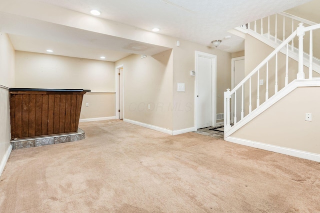 unfurnished living room featuring carpet