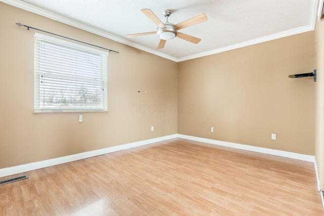 spare room with ceiling fan, light hardwood / wood-style flooring, and crown molding