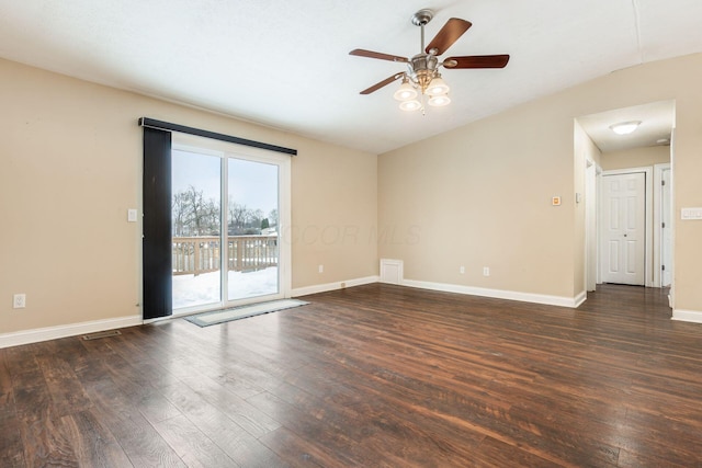 empty room with ceiling fan, dark hardwood / wood-style flooring, and lofted ceiling