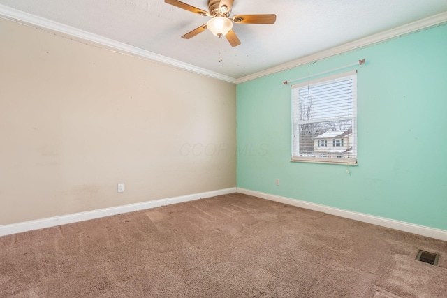 carpeted empty room with ceiling fan and ornamental molding