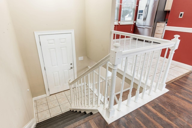 stairs with hardwood / wood-style flooring