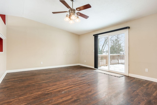 spare room featuring ceiling fan, dark hardwood / wood-style flooring, and lofted ceiling