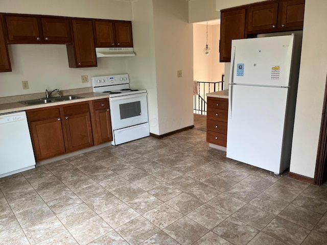 kitchen featuring sink and white appliances