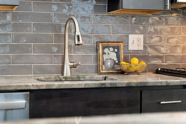 interior details with sink and decorative backsplash