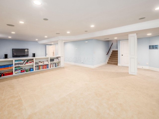 basement featuring light carpet