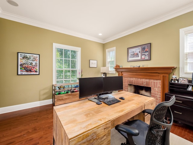 office featuring dark hardwood / wood-style floors, ornamental molding, and a fireplace