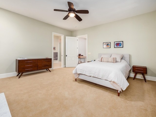 bedroom featuring ceiling fan and light colored carpet