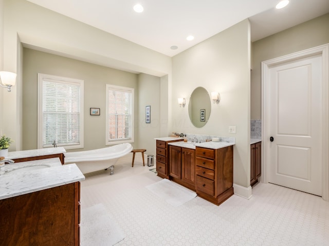 bathroom with a bathtub and vanity