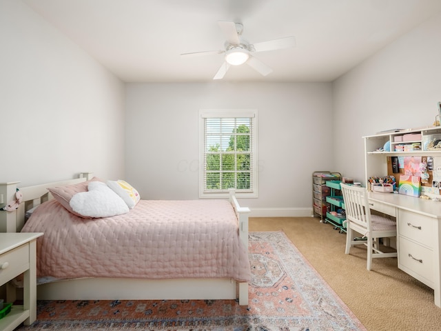 bedroom with light carpet and ceiling fan