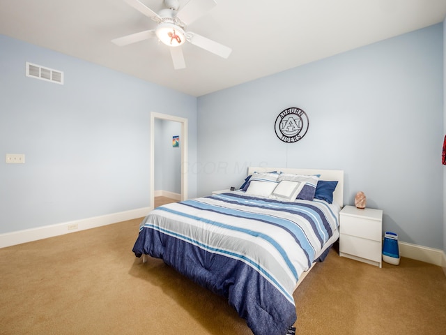 carpeted bedroom featuring ceiling fan