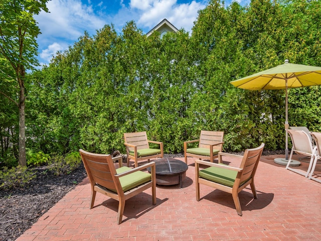 view of patio / terrace with an outdoor fire pit