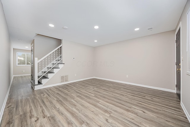 unfurnished living room with light wood-type flooring