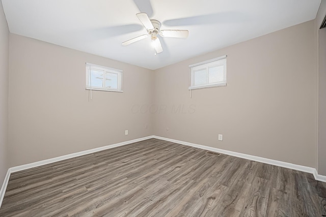 unfurnished room featuring ceiling fan and hardwood / wood-style flooring