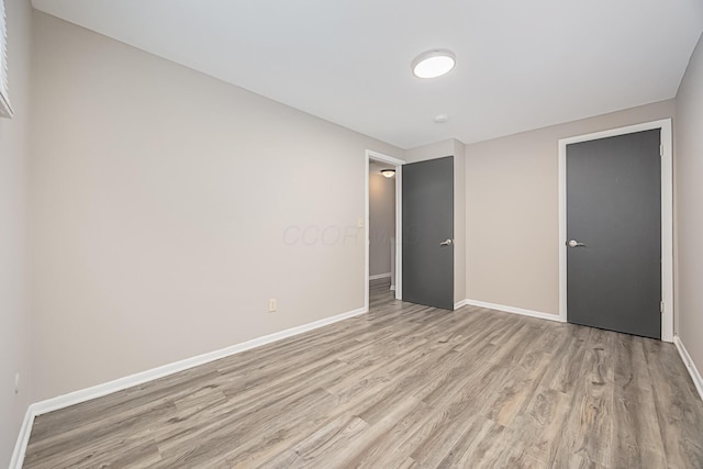 unfurnished bedroom with light hardwood / wood-style floors