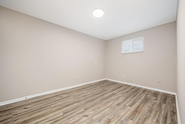 spare room with light hardwood / wood-style floors