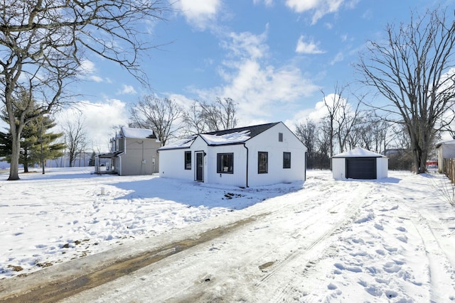 view of front of house featuring an outbuilding and a garage