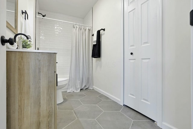 bathroom featuring tile patterned flooring, toilet, vanity, and a shower with curtain