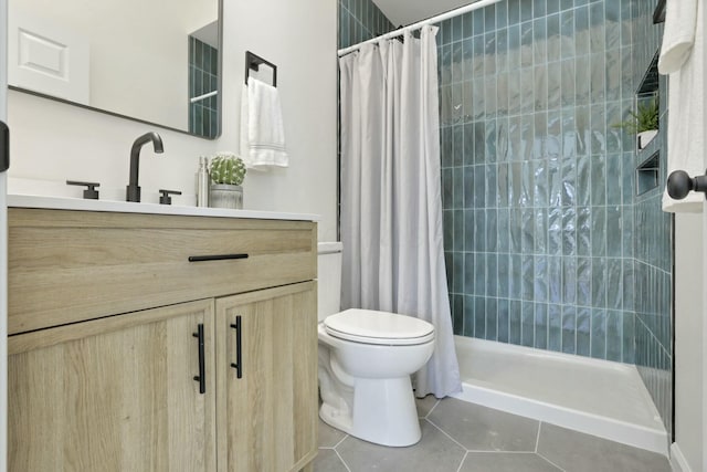 bathroom with tile patterned flooring, vanity, curtained shower, and toilet