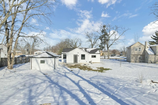 view of front of house with a garage and an outdoor structure