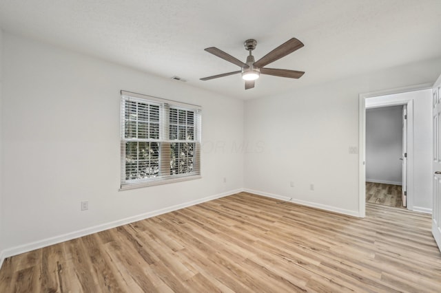 unfurnished room featuring ceiling fan and light hardwood / wood-style flooring