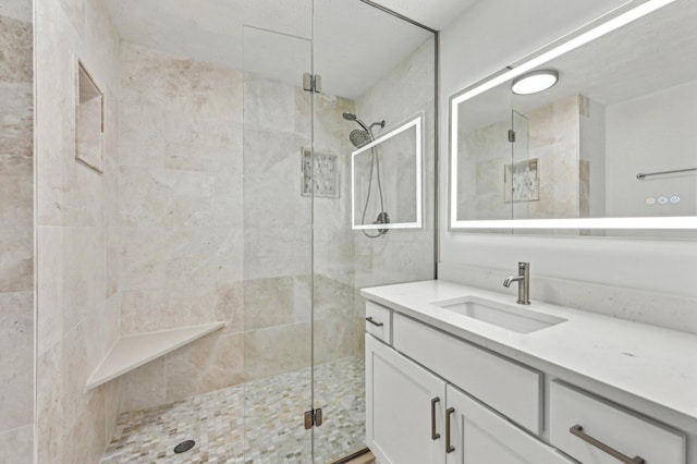 bathroom with vanity and an enclosed shower