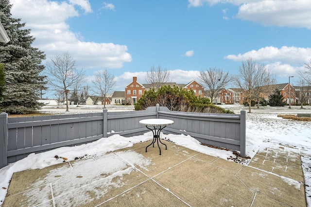 view of snow covered patio