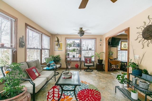 sunroom with ceiling fan