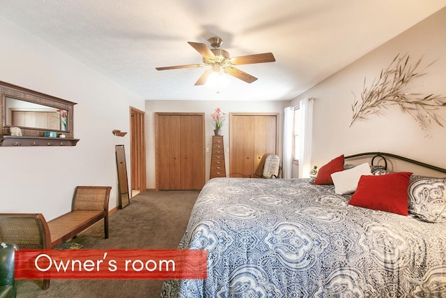 carpeted bedroom with multiple closets and ceiling fan