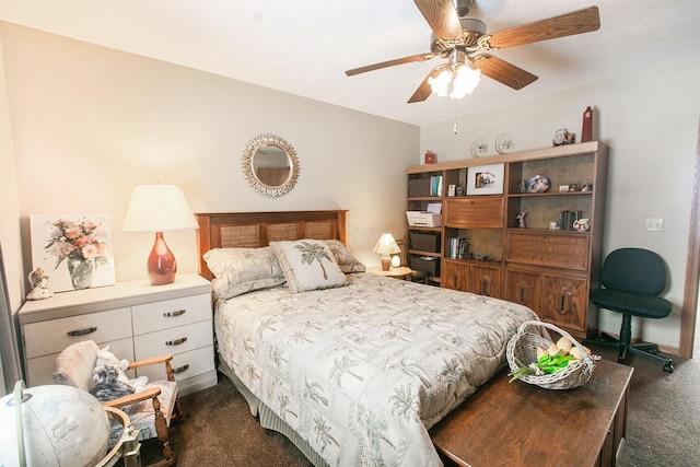 bedroom with ceiling fan and dark colored carpet