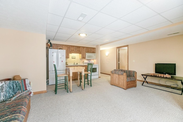 interior space featuring sink and a paneled ceiling