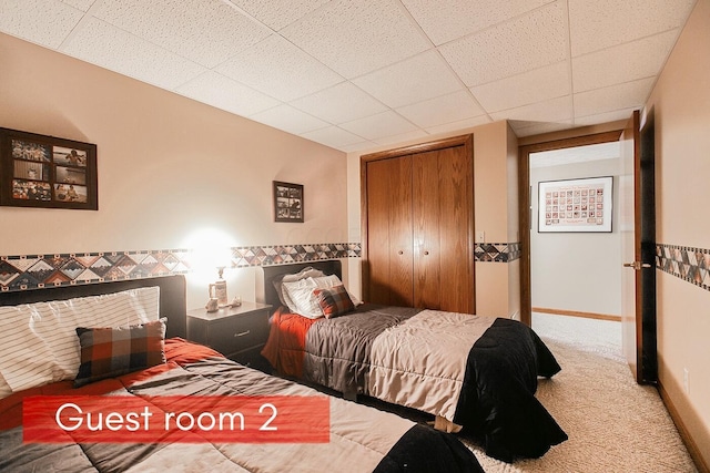 carpeted bedroom with a closet