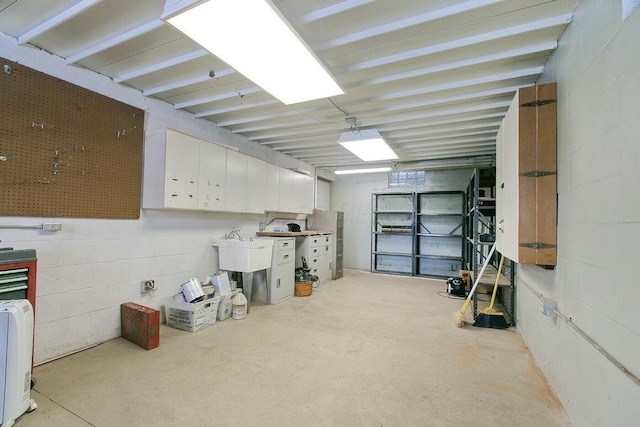 basement featuring sink and a workshop area