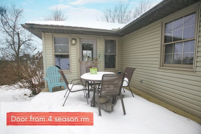 view of snow covered patio