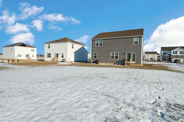 view of snow covered house