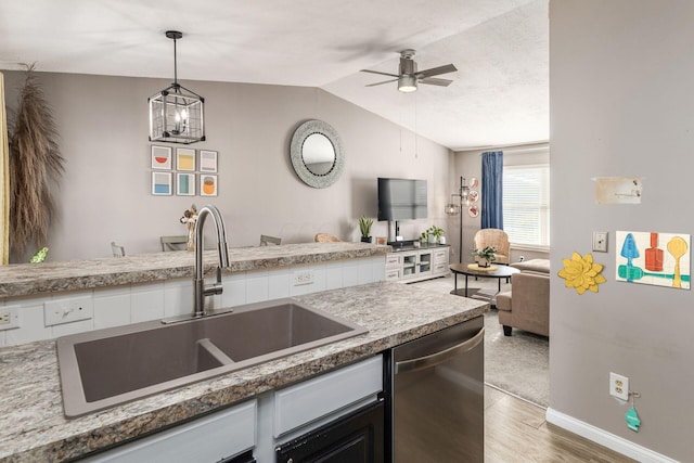 kitchen with ceiling fan with notable chandelier, pendant lighting, dishwasher, wood-type flooring, and sink