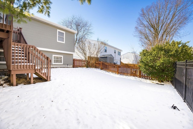 view of yard layered in snow