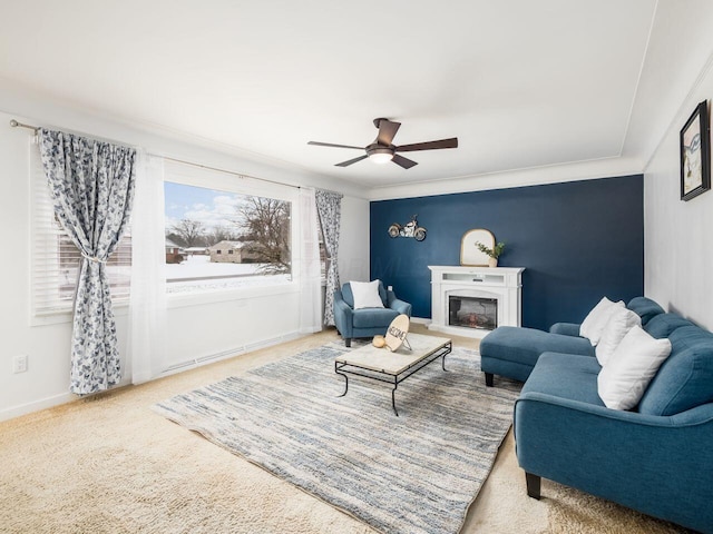 living room with crown molding, carpet, and ceiling fan