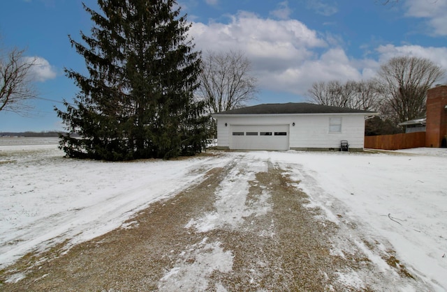 view of snow covered garage