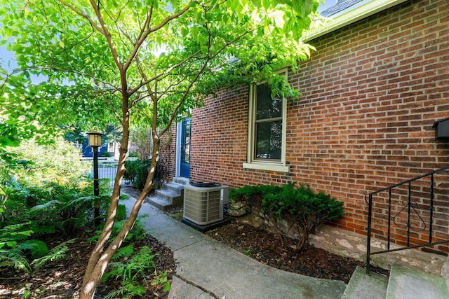 view of side of property with central AC unit