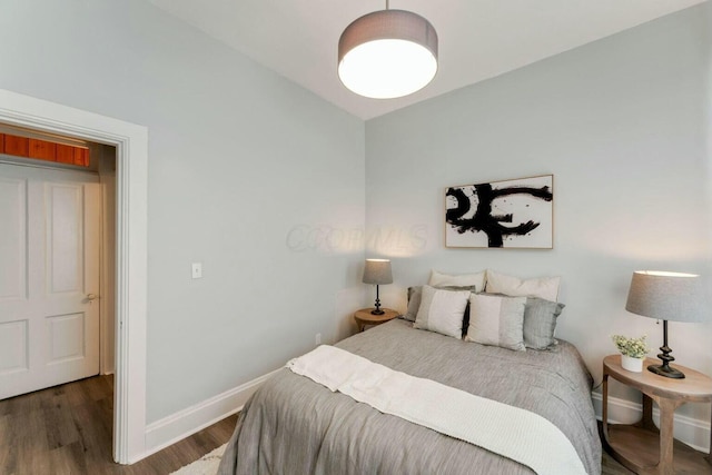 bedroom featuring dark wood-type flooring