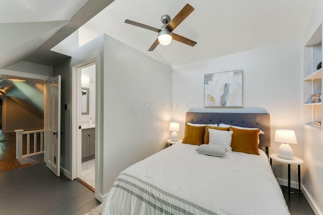 bedroom with vaulted ceiling, ceiling fan, dark hardwood / wood-style floors, and ensuite bath