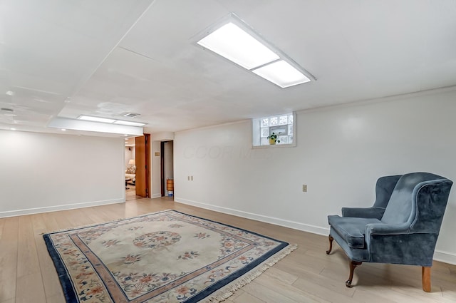 sitting room with light hardwood / wood-style floors