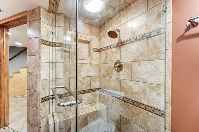 bathroom with a shower with shower door