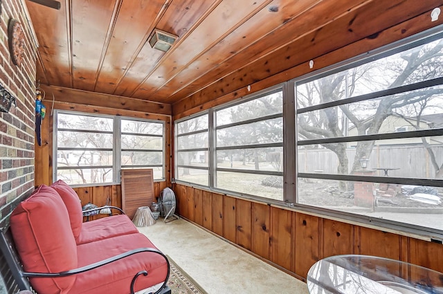 sunroom / solarium featuring wood ceiling