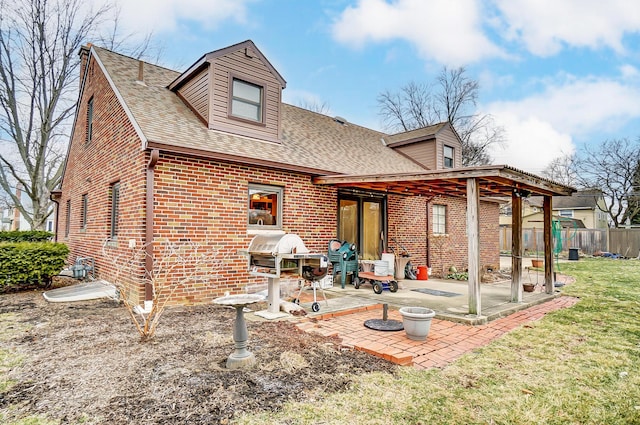 back of property featuring a patio and a lawn