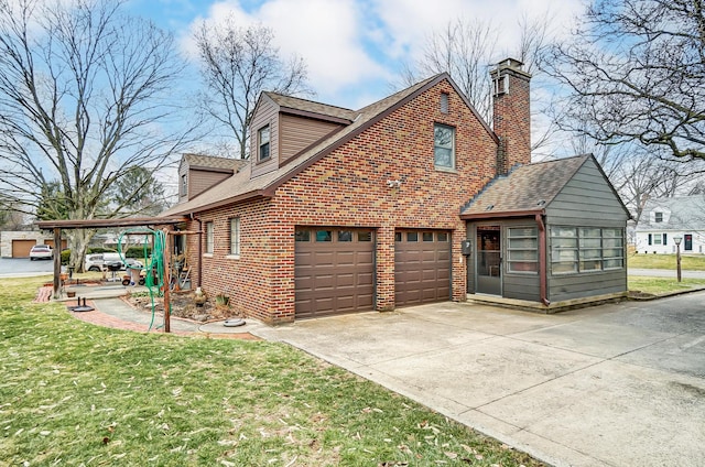 view of side of property featuring a garage, a lawn, and a carport