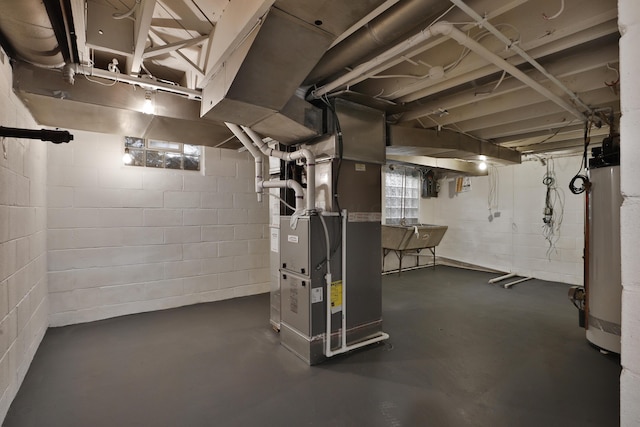 basement featuring sink, gas water heater, and heating unit