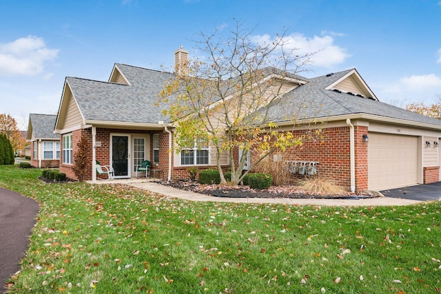 view of front of house with a front lawn and a garage